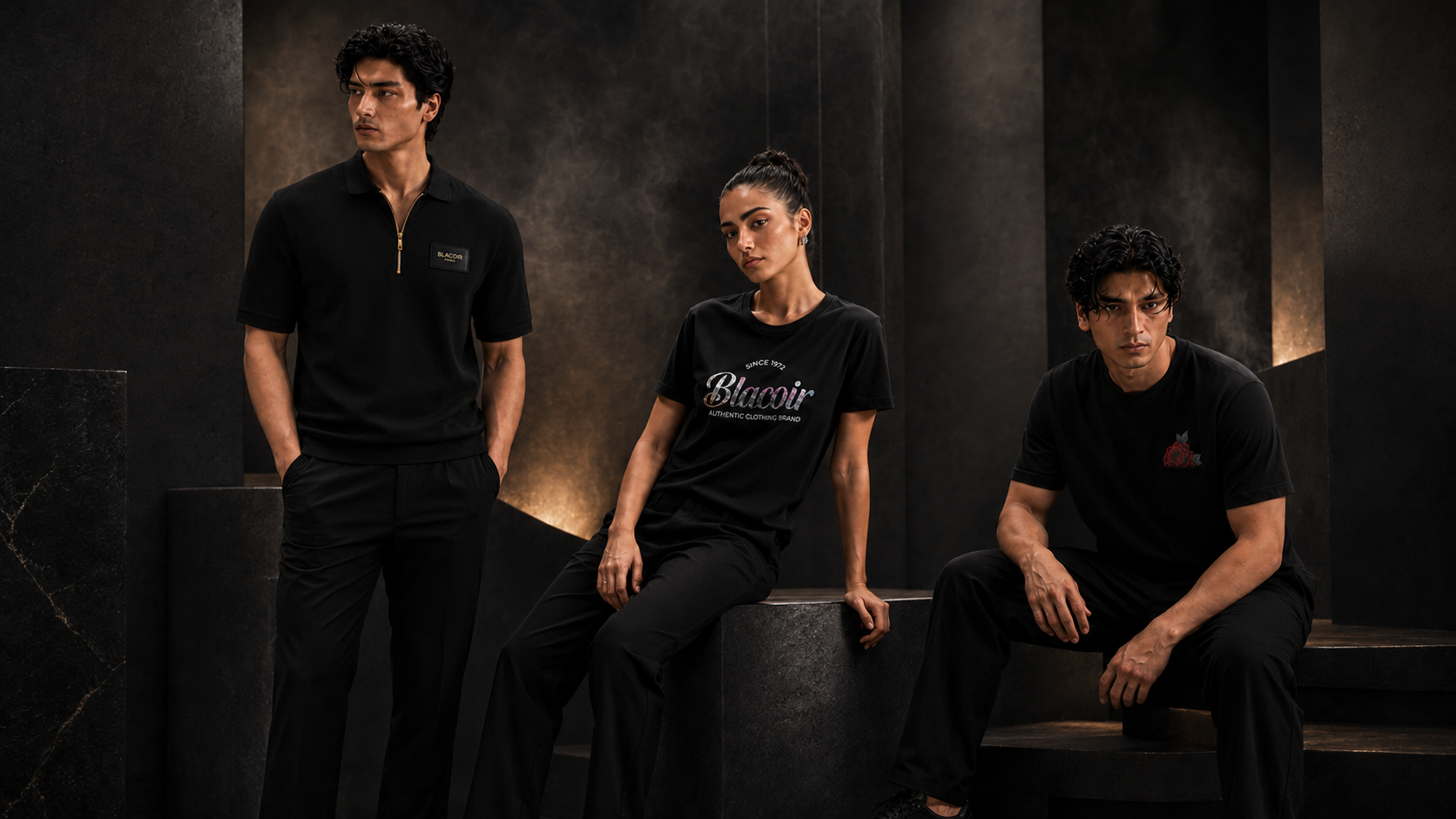 Blacoir The Core Edit campaign banner featuring men’s black zip polo, women’s glitter logo t-shirt, and rose pocket tee in a luxury studio s